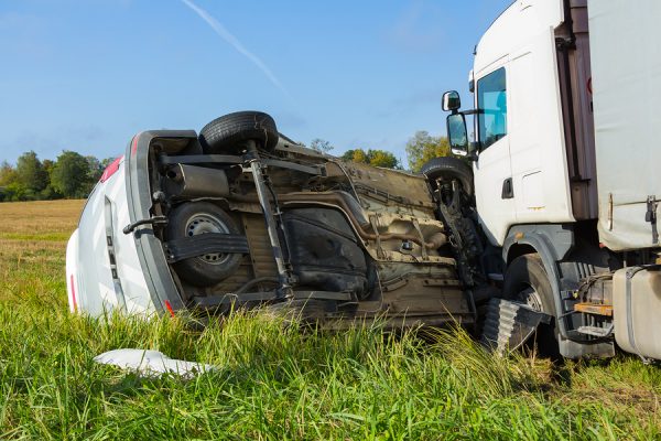 An 18-wheeler accident in sugar land tx with a white minivan.
