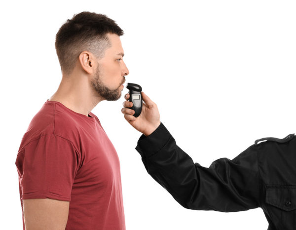 Police Inspector Conducting Alcohol Breathe Testing/breathalyzer